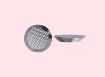 Two flat tactile studs displayed, one with a textured surface and the other smooth, ideal for enhancing tactile experiences.