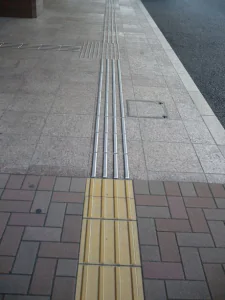 Tactile Paving installation on sidewalk